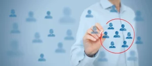 a person drawing a diagram of people